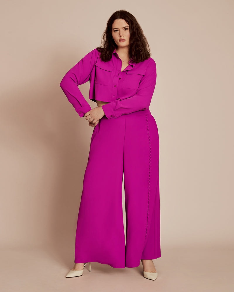 Front of a model wearing a size 12 The Danie Pant in Purple by 11 Honoré Collection. | dia_product_style_image_id:231266